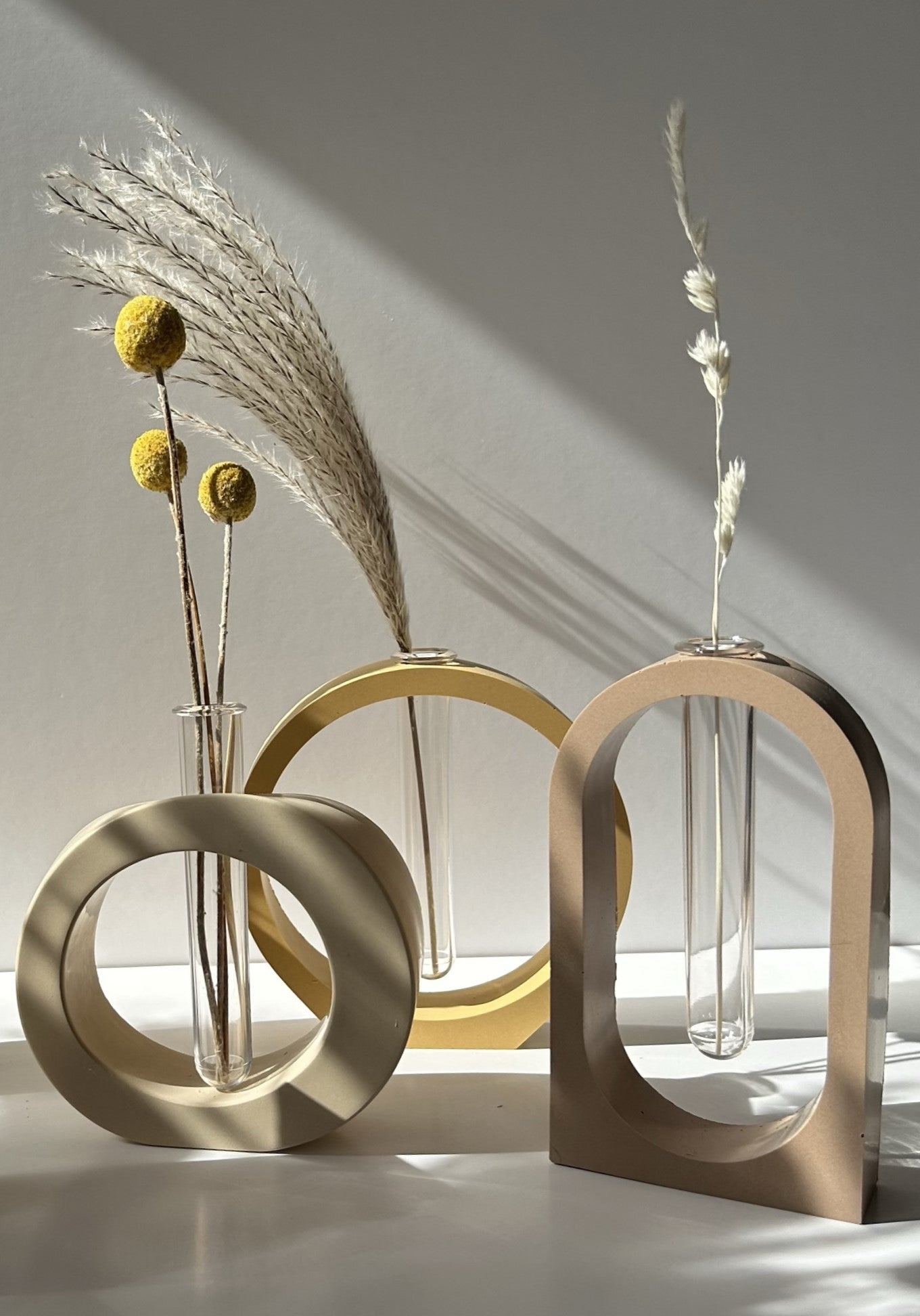 Elegant ROOT Propagation Vase in soft earthy tones, showcasing minimalist Scandinavian design and a removable test tube for easy plant growth.