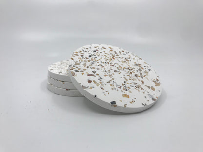 Terrazzo patterned coasters on a white background