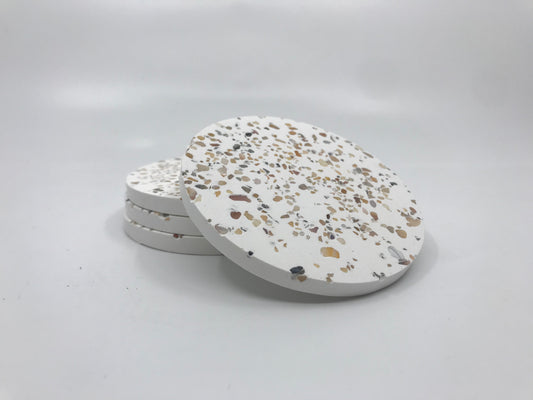 Terrazzo patterned coasters on a white background